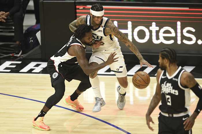 Jordan Clarkson (00) tries to get around Patrick Beverley (21)